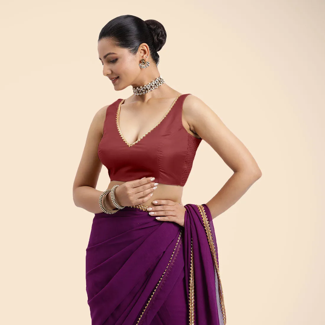 Raisa x Tyohaar | Auburn Red Sleeveless FlexiFit™ Saree Blouse with V Neckline with Golden Gota Lace Embellishment and Back Cut-out with Tie-Up